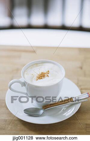 Cappuccino on a table View Large Photo Image Stock Photo - Cappuccino on a table. Fotosearch