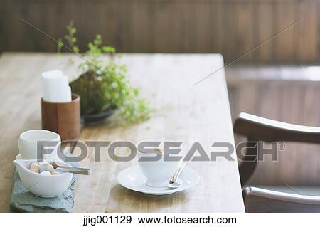Cappuccino on wooden table in a cafe View Large Photo Image Stock Photo - Cappuccino on wooden table in a cafe. Fotosearch