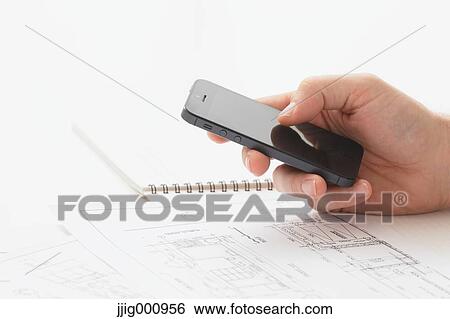 Stock Photograph - Close up of male hand working in the office. Fotosearch