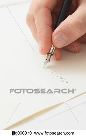 Close up of male hand writing on paper View Large Photo Image Stock Image - Close up of male hand writing on paper. Fotosearch