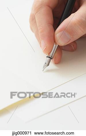 Close up of male hand writing on paper View Large Photo Image Stock Image - Close up of male hand writing on paper. Fotosearch
