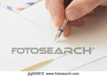 Close up of male hand writing on paper View Large Photo Image Stock Image - Close up of male hand writing on paper. Fotosearch