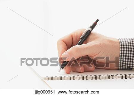 Close up of male hand writing on notebook View Large Photo Image Stock Image - Close up of male hand writing on notebook. Fotosearch