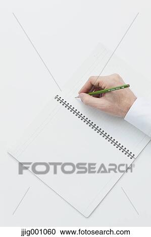Close up of male hand writing on notebook View Large Photo Image Stock Image - Close up of male hand writing on notebook. Fotosearch