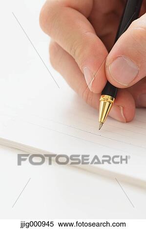 Close up of male hand writing on notebook View Large Photo Image Stock Photography - Close up of male hand writing on notebook. Fotosearch