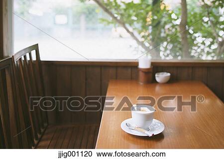 Coffee on wooden table in a cafe View Large Photo Image Stock Image - Coffee on wooden table in a cafe. Fotosearch
