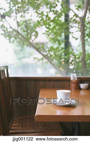 Coffee on wooden table in a cafe View Large Photo Image Stock Image - Coffee on wooden table in a cafe. Fotosearch