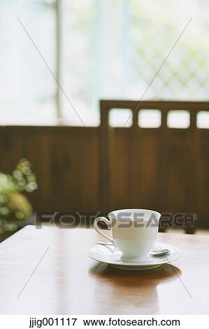 Coffee on wooden table in a cafe View Large Photo Image Stock Photo - Coffee on wooden table in a cafe. Fotosearch