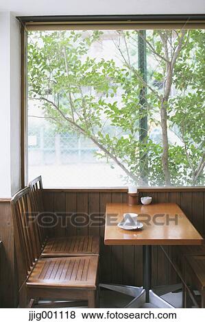 Coffee on wooden table in a cafe View Large Photo Image Stock Photo - Coffee on wooden table in a cafe. Fotosearch