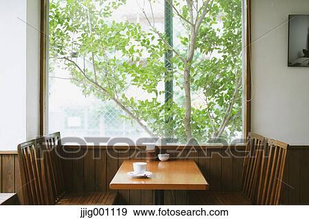 Coffee on wooden table in a cafe View Large Photo Image Stock Photo - Coffee on wooden table in a cafe. Fotosearch