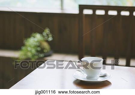 Coffee on wooden table in a cafe View Large Photo Image Stock Photograph - Coffee on wooden table in a cafe. Fotosearch