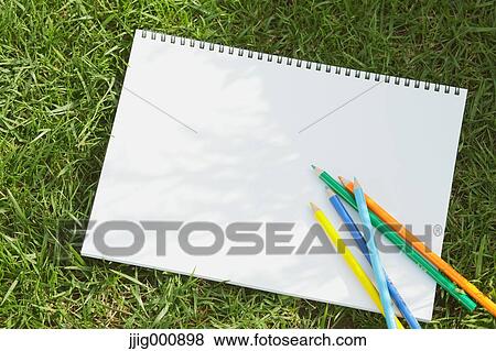 Colored pencil and sketchbook on grass View Large Photo Image Stock Photo - Colored pencil and sketchbook on grass. Fotosearch
