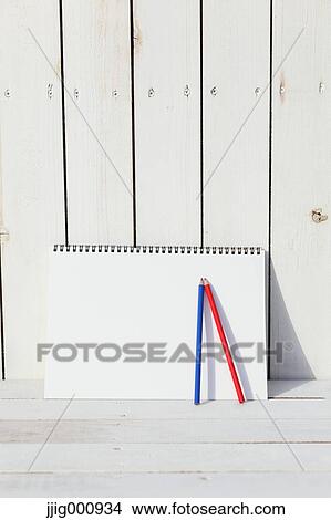 Colored pencils and sketchbooks against white wooden wall View Large Photo Image Picture - Colored pencils and sketchbooks against white wooden wall. Fotosearch