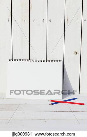 Colored pencils and sketchbooks against white wooden wall View Large Photo Image Stock Image - Colored pencils and sketchbooks against white wooden wall. Fotosearch