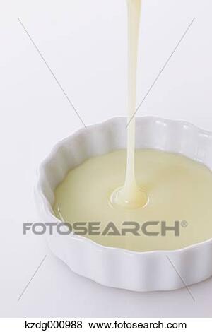 Condensed milk View Large Photo Image Stock Photo - Condensed milk . Fotosearch