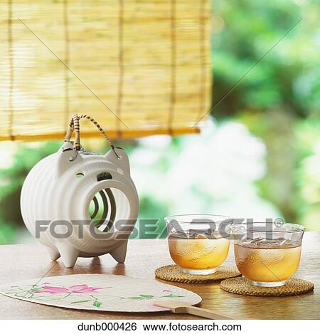 Fan, barley tea and mosquito coil on table View Large Photo Image Stock Photograph - Fan, barley tea and mosquito coil on table. Fotosearch
