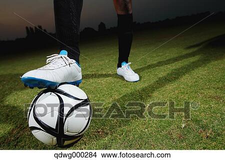 Football player stopping the ball View Large Photo Image Picture - Football player stopping the ball. Fotosearch