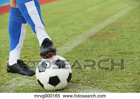 Football player stopping the ball View Large Photo Image Stock Photography - Football player stopping the ball. Fotosearch