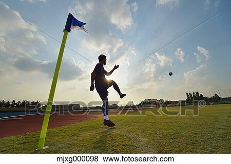 Football player taking a corner kick View Large Photo Image Stock Photo - Football player taking a corner kick. Fotosearch