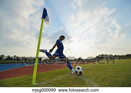Football player taking a corner kick View Large Photo Image Stock Photo - Football player taking a corner kick. Fotosearch