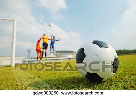 Football players aiming for the ball View Large Photo Image Stock Image - Football players aiming for the ball. Fotosearch