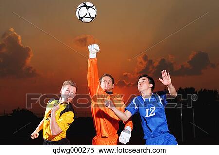 Football players aiming for the ball View Large Photo Image Stock Photography - Football players aiming for the ball. Fotosearch