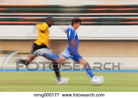 Football players running with ball View Large Photo Image Stock Photo - Football players running with ball. Fotosearch