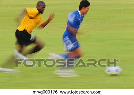 Football players running with ball View Large Photo Image Stock Photograph - Football players running with ball. Fotosearch