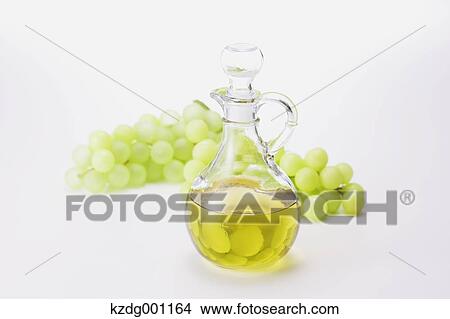 Grape seed oil and grapes View Large Photo Image Picture - Grape seed oil and grapes. Fotosearch