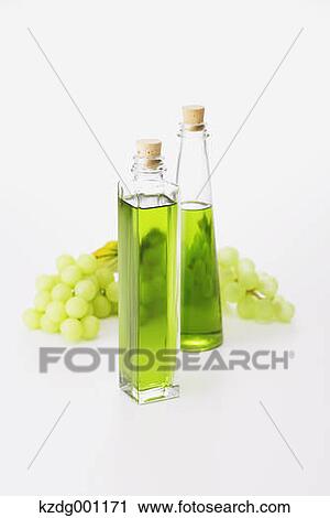 Grape seed oil and grapes View Large Photo Image Stock Image - Grape seed oil and grapes. Fotosearch