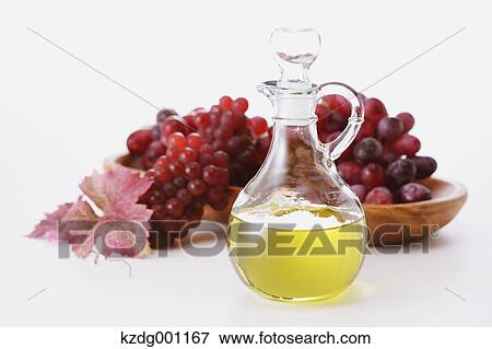 Stock Photo - Grape seed oil and grapes. Fotosearch