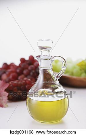 Stock Photo - Grape seed oil and grapes. Fotosearch