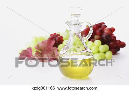 Stock Photograph - Grape seed oil and grapes. Fotosearch