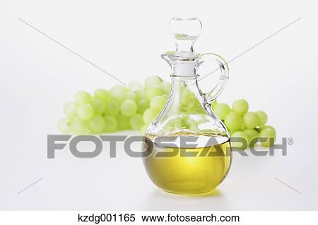 Grape seed oil and grapes View Large Photo Image Stock Photography - Grape seed oil and grapes. Fotosearch