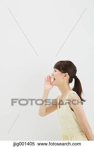 Japanese young woman in a one piece dress standing against white background View Large Photo Image Stock Photography - Japanese young woman in a one piece dress standing against white background. Fotosearch