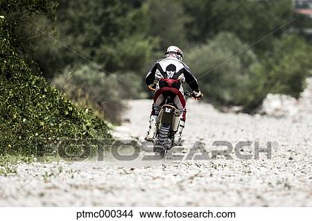 Man Riding Enduro Bike on Stony Trail View Large Photo Image Picture - Man Riding Enduro Bike on Stony Trail. Fotosearch