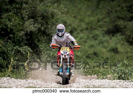 Man Riding Enduro Bike on Stony Trail View Large Photo Image Stock Image - Man Riding Enduro Bike on Stony Trail. Fotosearch