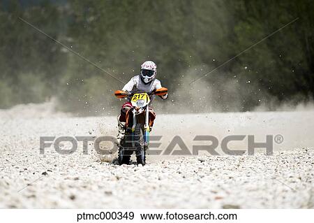 Man Riding Enduro Bike on Stony Trail View Large Photo Image Stock Photo - Man Riding Enduro Bike on Stony Trail. Fotosearch