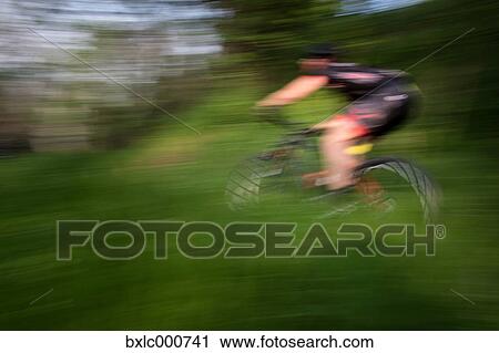 Man riding mountain bike in nature in the Bologna countryside, Italy View Large Photo Image Stock Image - Man riding mountain bike in nature in the Bologna countryside, Italy. Fotosearch