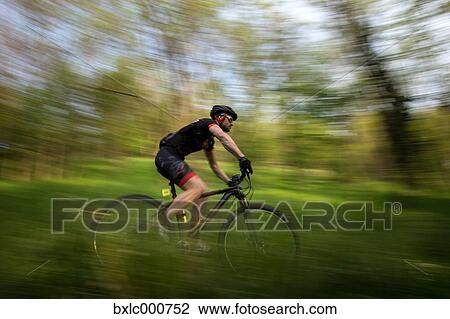 Man riding mountain bike in nature in the Bologna countryside, Italy View Large Photo Image Stock Image - Man riding mountain bike in nature in the Bologna countryside, Italy. Fotosearch