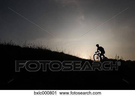 Man riding mountain bike in nature in the Bologna countryside, Italy View Large Photo Image Stock Image - Man riding mountain bike in nature in the Bologna countryside, Italy. Fotosearch