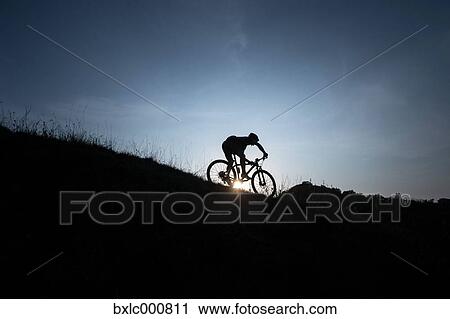 Man riding mountain bike in nature in the Bologna countryside, Italy View Large Photo Image Stock Image - Man riding mountain bike in nature in the Bologna countryside, Italy. Fotosearch