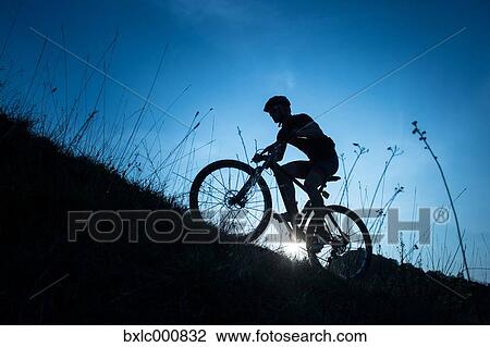 Man riding mountain bike in nature in the Bologna countryside, Italy View Large Photo Image Stock Image - Man riding mountain bike in nature in the Bologna countryside, Italy. Fotosearch
