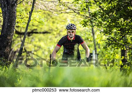 Man riding mountain bike in nature in the Bologna countryside, Italy View Large Photo Image Stock Image - Man riding mountain bike in nature in the Bologna countryside, Italy. Fotosearch