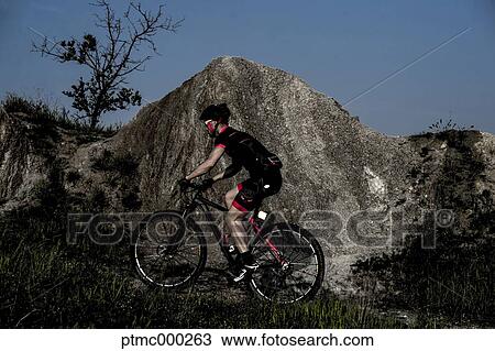 Man riding mountain bike in nature in the Bologna countryside, Italy View Large Photo Image Stock Image - Man riding mountain bike in nature in the Bologna countryside, Italy. Fotosearch