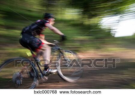 Man riding mountain bike in nature in the Bologna countryside, Italy View Large Photo Image Stock Photo - Man riding mountain bike in nature in the Bologna countryside, Italy. Fotosearch