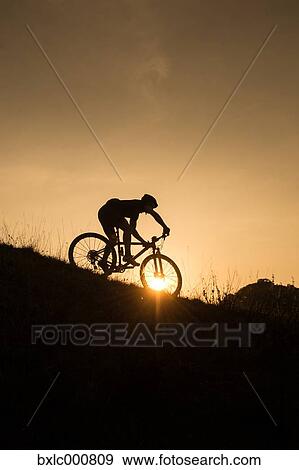 Man riding mountain bike in nature in the Bologna countryside, Italy View Large Photo Image Stock Photo - Man riding mountain bike in nature in the Bologna countryside, Italy. Fotosearch