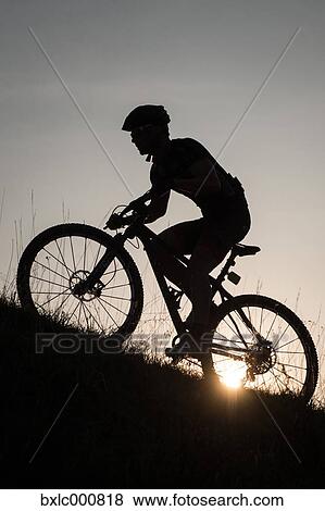 Man riding mountain bike in nature in the Bologna countryside, Italy View Large Photo Image Stock Photo - Man riding mountain bike in nature in the Bologna countryside, Italy. Fotosearch
