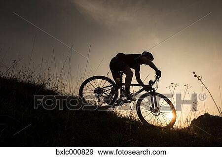 Man riding mountain bike in nature in the Bologna countryside, Italy View Large Photo Image Stock Photo - Man riding mountain bike in nature in the Bologna countryside, Italy. Fotosearch