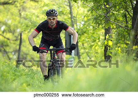 Man riding mountain bike in nature in the Bologna countryside, Italy View Large Photo Image Stock Photography - Man riding mountain bike in nature in the Bologna countryside, Italy. Fotosearch
